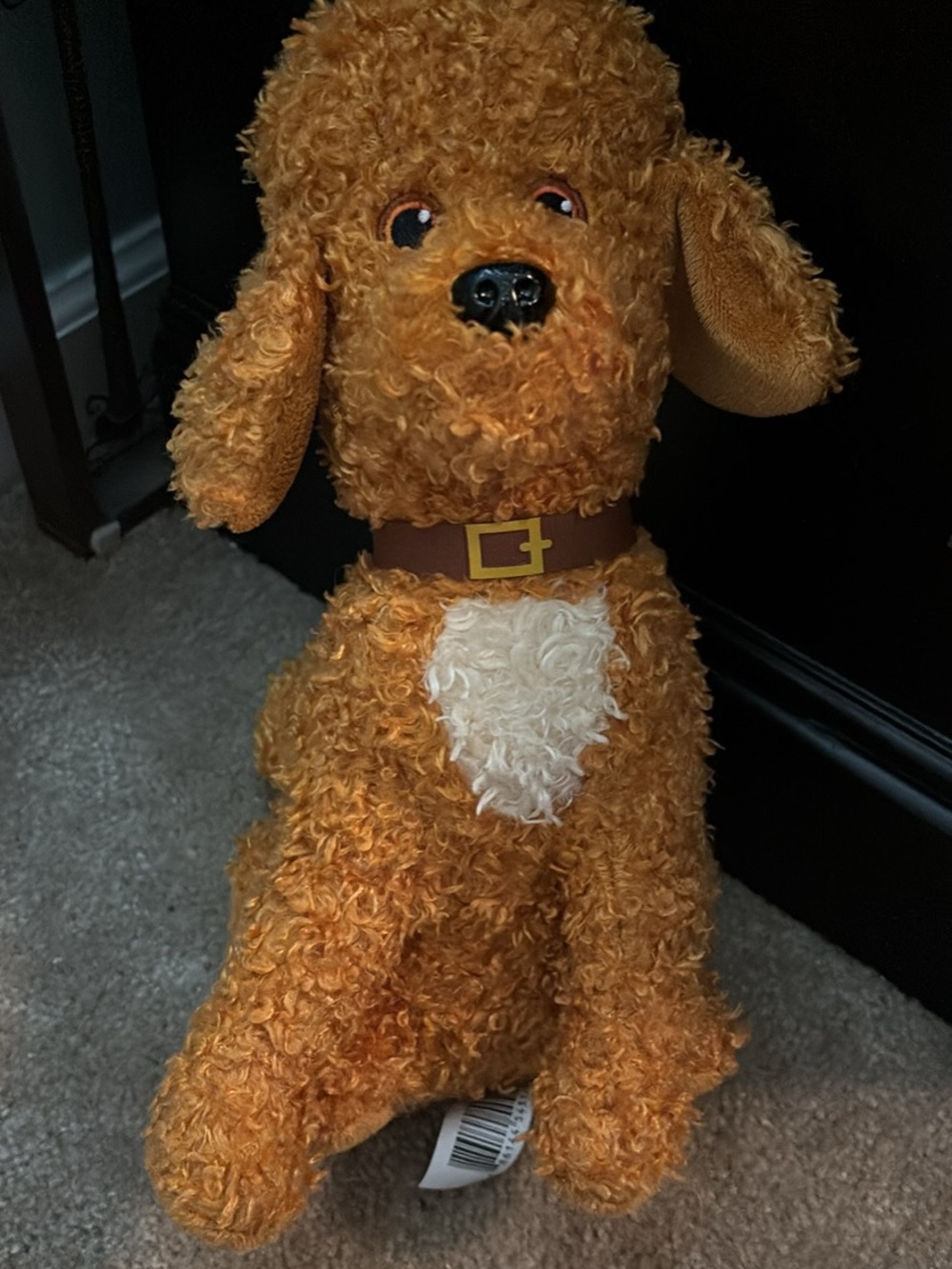 Plush Orange Curly Dog Toy with White Chest and Brown Collar